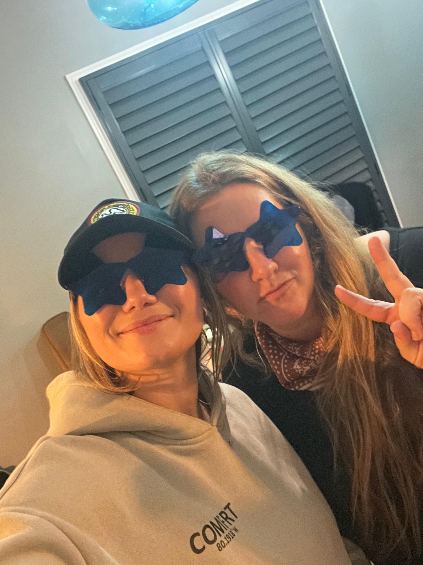 Two attendees in star sunglasses at a SongShare gathering